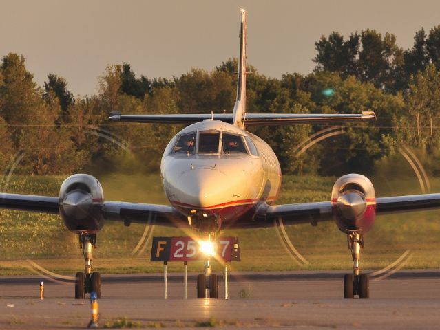 Fairchild Dornier SA-227DC Metro (C-FYWG) - Turning off after landing on Rwy 07 at sunset.