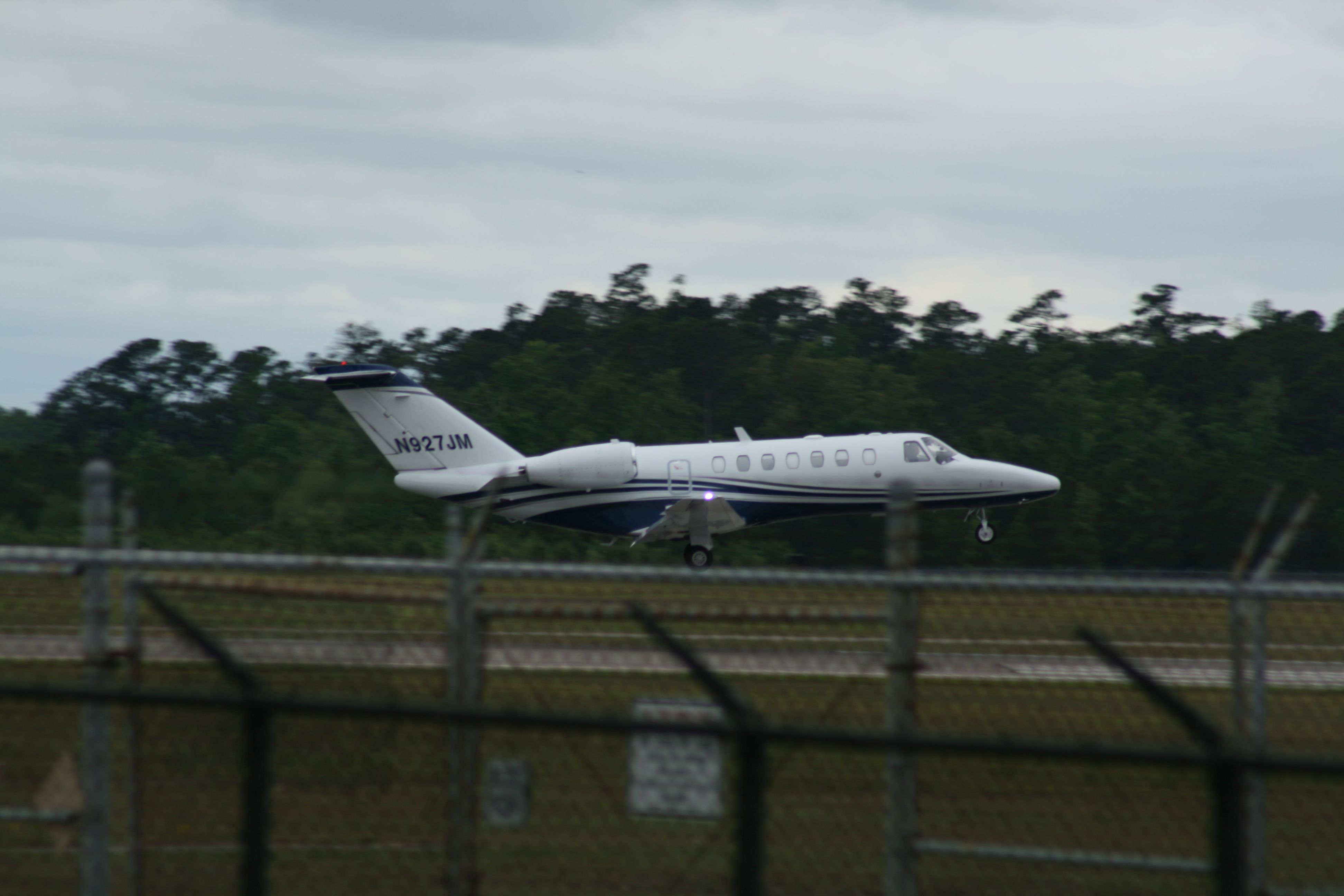 Cessna Citation CJ3 (N927JM) - N927JM landing at KILM on a cloudy day