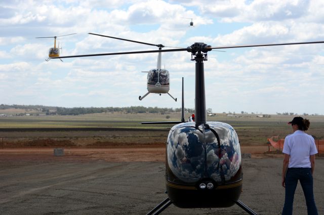 Robinson R-44 — - Queuing up R44s at Wellcamp Airport open day 28 September 2014br /In order: VH-TSM VH-KCH VH-OTA VH-YYG