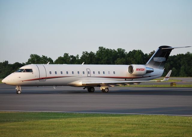 Canadair Regional Jet CRJ-200 (N141SH) - STEWART-HAAS RACING LLC arriving at KJQF - 6/1/14