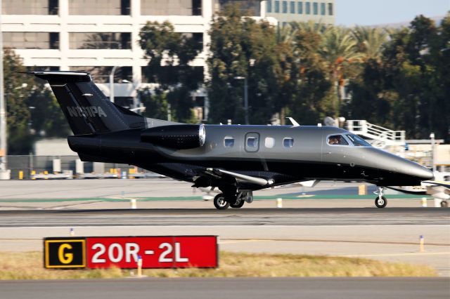 Embraer Phenom 100 (N161PA) - Phenom 100 bearing a distinct gray and black livery rolls to a stop at JWA.