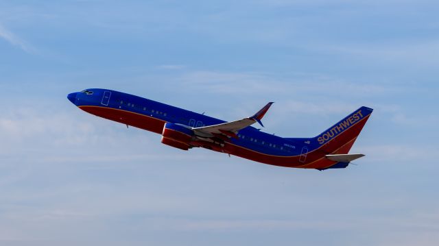 Boeing 737-800 (N8639B) - Southwest Airlines 737-800 taking off from PHX on 9/3/22. Taken with a Canon 850D and Rokinon 135mm f/2 manual focus lens.