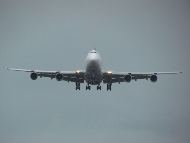 Boeing 747-400 (N400SA) - Taken on a rainy July 27 at KCVG from the viewing parking lotbr /br /Southern Air Cargo 747-400 landing on runway 27