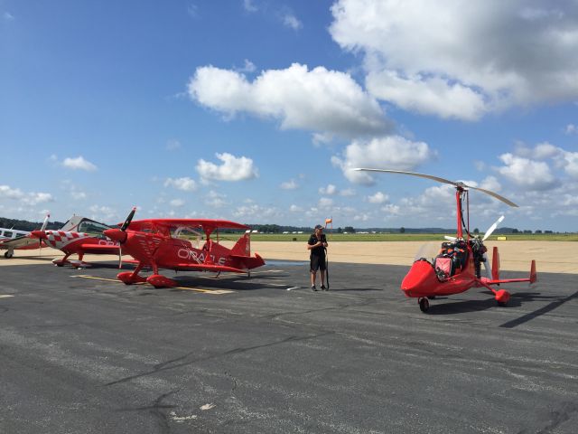 Experimental 100kts (N322MG) - Sean Tucker looking over gyroplane N322MG "Missing Link II" at KCGI in August 2015, shortly after Paul Salmon had set new Transcontinental Speed Records with the machine.  