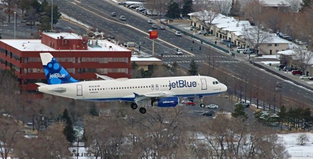 Airbus A320 (N536JB) - One of the most famous aircraft in JBUs fleet, Canyon Blue (N536JB) is caught in this photo taken yesterday (Jan 19, 2018) as it is about to pass over South McCarran while on approach to 34L.