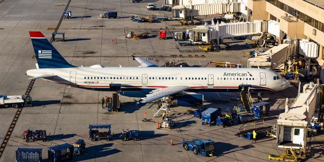 Airbus A321 (N578UW) - American Airlines A321 in US Airways retro livery parked at sunset at PHX on 10/29/22. Taken with a Canon 850D and Tamron 70-200 G2 lens. 72 MP stitched panorama reduced from 134 MP stitched panorama.