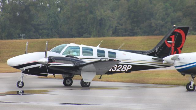 Beechcraft Baron (58) (N328P) - This slick little Baron had just landed from Panama City, FL.