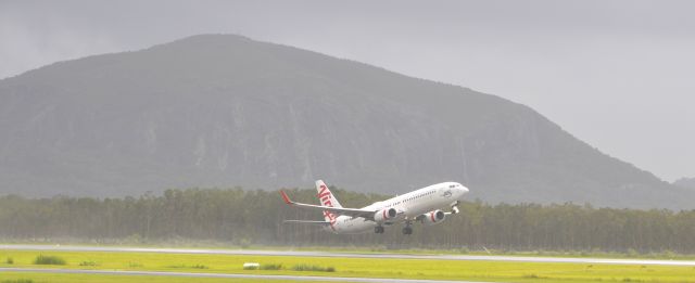 VH-YIA — - Surely one of the most scenic backdrops to an airport.In the rain Mount Coolum in the background. QLD, Australia.