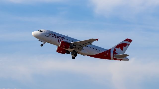 Airbus A319 (C-GBHO) - Air Canada Rouge A319 taking off from PHX on 9/3/22. Taken with a Canon 850D and Rokinon 135mm f/2 manual focus lens.