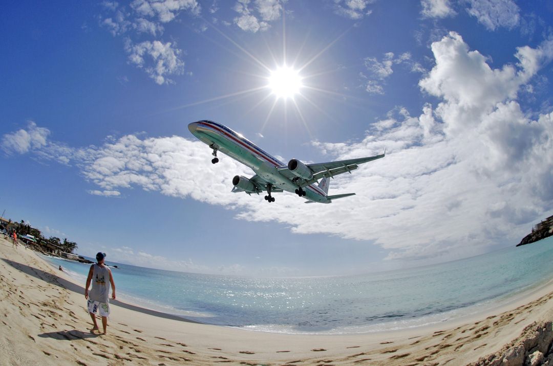 Boeing 757-200 — - mid day and the sun reflects upward to light up the fuselage.