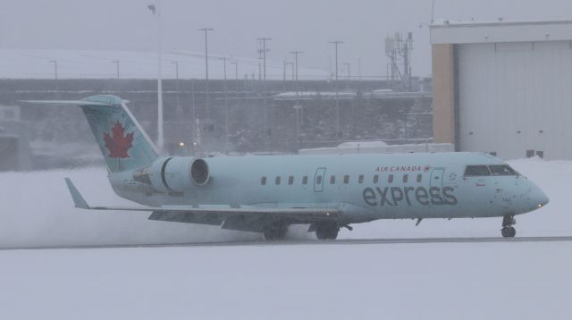 Canadair Regional Jet CRJ-200 (C-FFJA) - Canadair CRJ-200 (C-FFJA) flying as Air Canada Jazz 8665 from EWR arrives in a snowy YOW on Runway 07 on 26 Jan 23.  