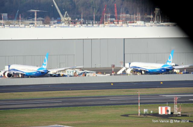 Boeing 787-9 Dreamliner — - Boeing Field, Seattle,WA USA - 2 of the 1st 787-9 for flight testing. Photo taken at 55mph while driving. Excuse the blur.