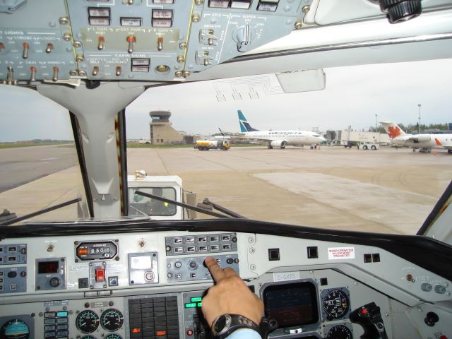 C-GXPS — - Flightdeck shot of Saab 340A for Corporate Express Airlines. Aircraft is just completing pushback to taxi for flight to CYYC. Typical busy morning on ramp at CYMM April 9th, 2007 with WestJet and Air Canada Jazz at terminal building.