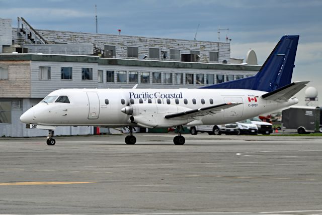 Saab 340 (C-GPCF) - ex-Westjet Link partially painted back in Pasco colour.