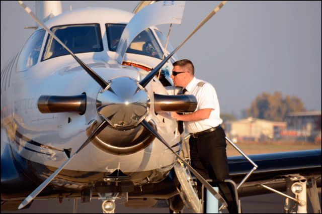 Pilatus PC-12 (N451SS) - The pilot looking for the oil dipstick