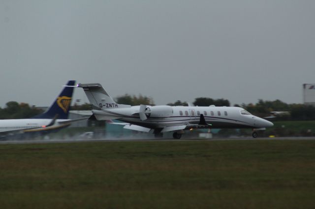 Bombardier Learjet 75 (G-ZNTH) - A Zenith Aviation Learjet 75 slowing down after landing on runway 22 at London Stansted Airport.br /br /Location: London Stansted Airport.br /Date: 12.10.22 (dd/mm/yy).