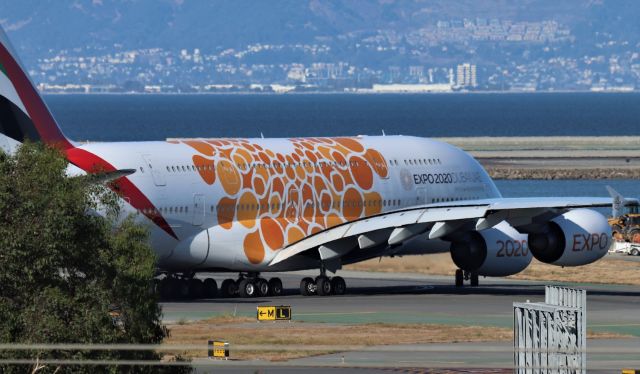 Airbus A380-800 (A6-EOE) - KSFO - This is about as close as I could get to this jet filming from the BART garage. I did not know there is a new long term parking structure where I could have taken some decent departure photos - but the Emirates 'tiny bubbles' shown here on taxi to Runway 28L for departure 9/20/2019.