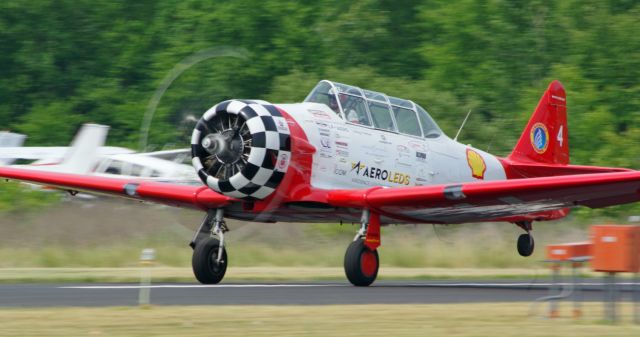 North American T-6 Texan (N601JF) - GREENWOOD LAKE AIRPORT, WEST MILFORD, NEW JERSEY, USA-JUNE 11, 2023: Seen by RF at the 2023 Greenwood Lake Airshow was the Aeroshell Aerobatic Team. This team flies four AT-6 Texans. Here we see plane number 4, with Pilot Jimmy Fordham, at the controls, taking off to start their performance.