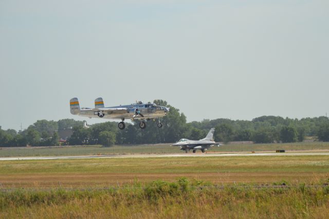 N27483 — - Evolution of Tactical Warfare.  North American B-25J "Miss Mitchell" Touch and go at KFSD and McDonnell Douglas F-16 awaiting departure - 7-17-2012