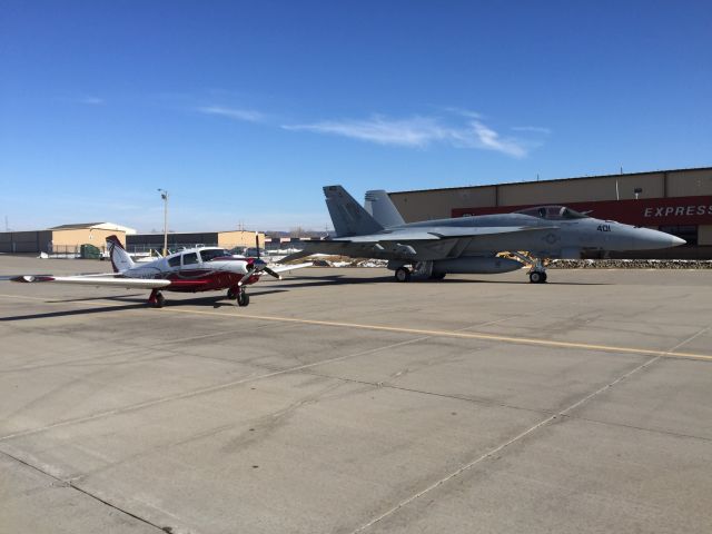 — — - How can you NOT make this photo happen with a Super Hornet siting on the civilian side of the ramp?  If the Comanche only had a cannon!!!