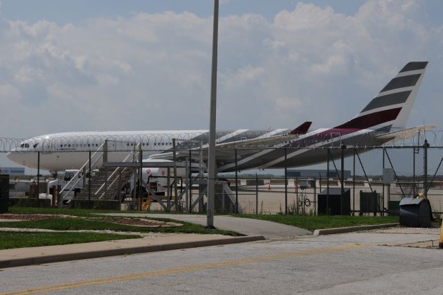 Airbus A330-200 (9H-CLX) - Dang fence, poles, and ramp clutter!