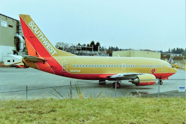 Boeing 737-500 (N522SW) - KPAE - Jan 2000 I was parked at the south end by the Snohomish County Fire Station parking lot watching the runways - when I looked in the Mirror and a ramp crew was towing N522 out to where you see it now. It sat here for a bit until the crew returned w/2 Pilots and support people and they fired this -500 up and taxi'ed to take off and departed......I got the rest on video.