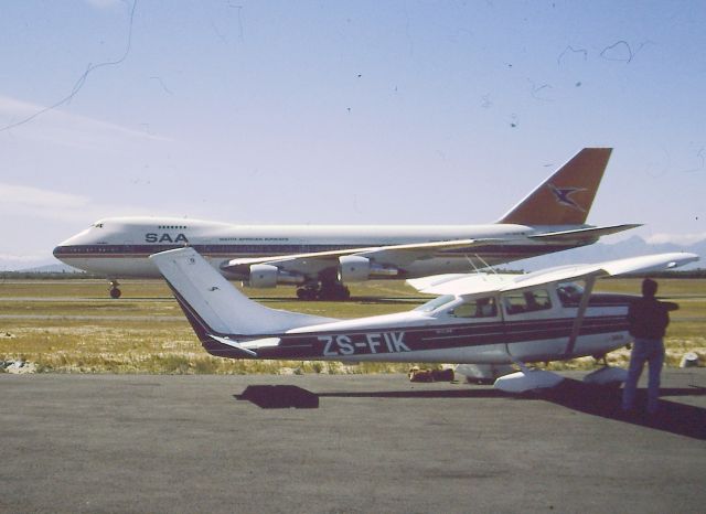 Cessna Skylane (ZS-FIK) - Small meets big at Cape Town South Africa.