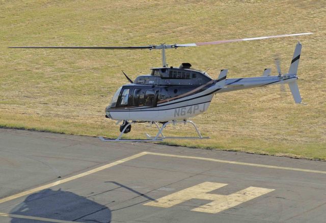 Learjet 60 (N64PJ) - 1984 Bell 206L-3 departs Merced Regional Airport