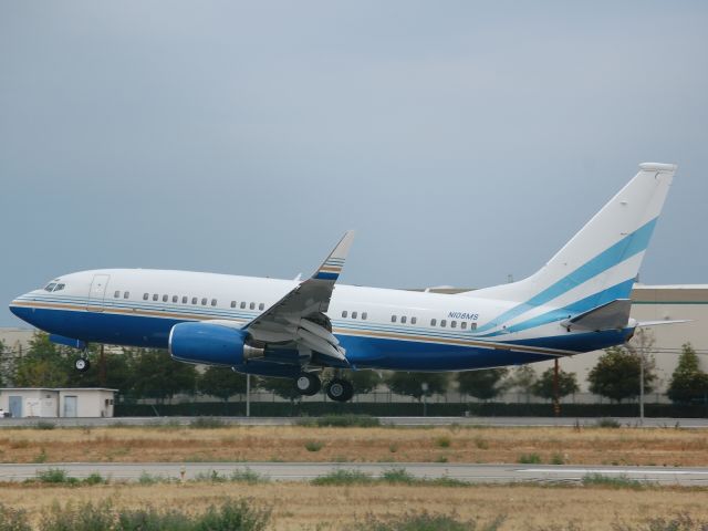 Boeing 737-700 (N108MS) - BBJ 737-700 moments from touching down on runway 16R at Van Nuys.