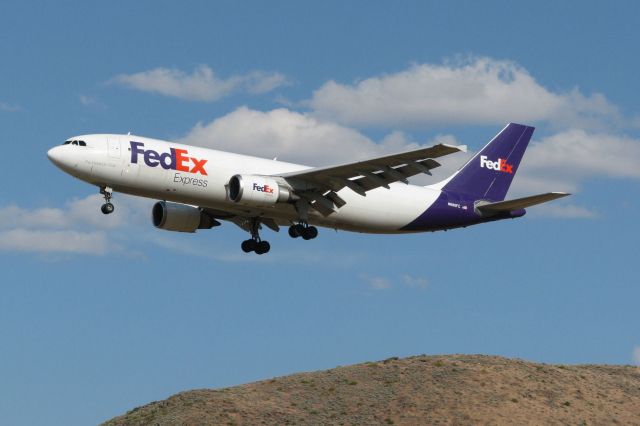 Airbus A300F4-600 (N680FE) - Snapped just three and a half hours ago, Fed Exs A306 "Tierney" passes Rattlesnake Mountain as it approaches KRNOs runway 34L at the end of a flight (FDX 723)from KMEM.