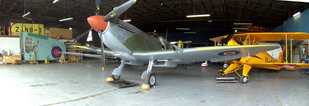 — — - Spitfire in Hanger