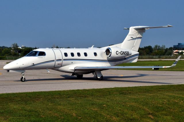 Embraer Phenom 300 (C-GNSB) - Taxiing for departure on runway 33. 