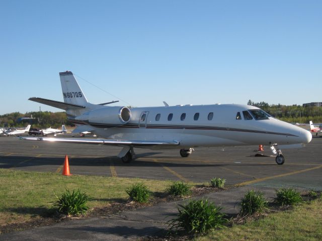 Cessna Citation Excel/XLS (N697QS) - Sitting in the light of the setting sun.