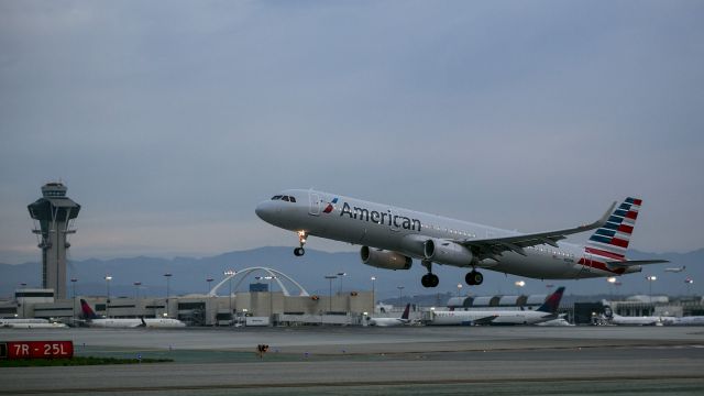 Airbus A321 (N101NN) - Early morning takeoff from Runway 25L, LAX. Los Angeles, California USA 20 Dec 2014 