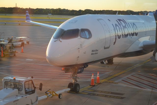 Airbus A220-300 (N3189J) - "I Wish Blue Were Here" (A220-371) at gate D53 in Milwaukee as the sun came up
