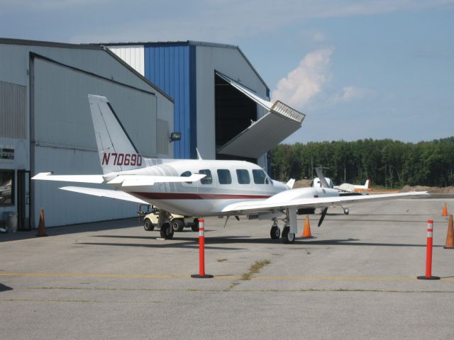 Piper Navajo (N7069D) - Parked in front of Infinity Aviation.