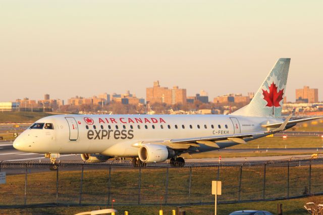 Embraer 175 (C-FEKH) - Air Canada Express (AC/RS) C-FEKH ERJ-175 SU [cn17000102]br /New York LaGuardia (LGA). Air Canada Express / Sky Regional flight AC7639 / RS7639 taxis for departure to Montreal Trudeau (YUL) catching the final rays of winter sunshine. 2017 11 29br /Taken from Planeview Park, 23rd Avenue at the end of Runway 4/22br /a rel=nofollow href=http://alphayankee.smugmug.com/Airlines-and-Airliners-Portfolio/Airlines/AmericasAirlines/Air-Canada-Express-AC/i-Np4WkSphttps://alphayankee.smugmug.com/Airlines-and-Airliners-Portfolio/Airlines/AmericasAirlines/Air-Canada-Express-AC/i-Np4WkSp/a