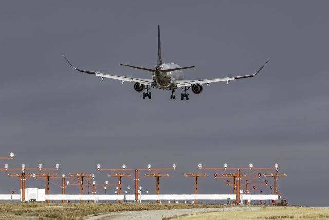 Embraer 175 (N132SY) - Hanging out on the tarmac at Denver International Airport.