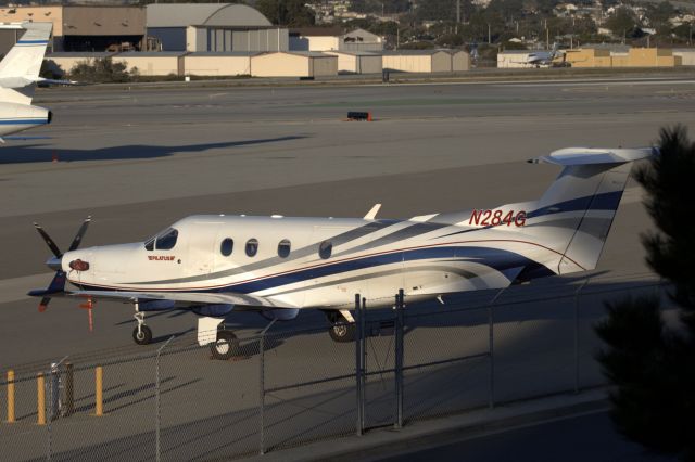 Pilatus PC-12 (N284G) - KMRY - N284G relegated to the back parking lot to make room for the larger jets at Monterey 2015 ATT.