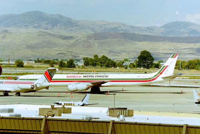 McDonnell Douglas DC-8-70 (N8084U) - KRNO - Summer 1999 checking out the freighter ramp at Reno, this DC-8-71 was originally delvd to United Airlines as a full passenger jet - then being converted to a -71 many years later. After a few other operators used this jet, Emery Worldwide took this up a few years before this snap for it's large freight service route.