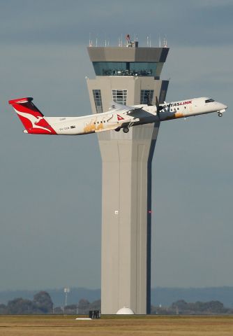 de Havilland Dash 8-400 (VH-QOW) - A great view of the nearly completed control tower at Melbourne Airport.