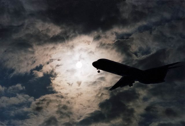 Boeing 727-100 — - A Boeing 727 comes in for a landing in Atlanta against a bright sky.br /br /Digital image processed from a photo taken in 1987 and scanned a long time ago.