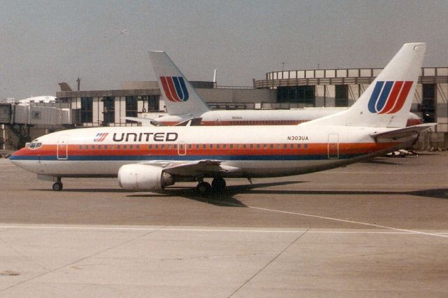 BOEING 737-300 (N303UA) - Seen here on 14-Apr-91.  With United from Dec-86 to Mar-13.  Broken up at KTUP.