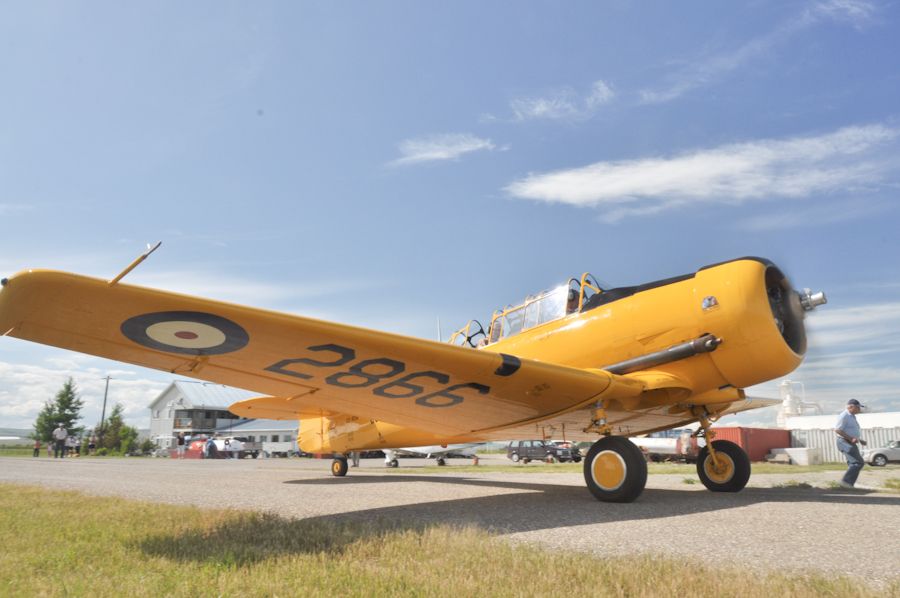 North American T-6 Texan (C-FROA) - Harvard Mk. IV (CF-ROA) The "High Flight" Harvard Flown by John Gillespie Magee RCAF at No. 2 STFS Uplands Ottawa ON Canada at Vintage Wings of Canada Yellow Wings Tour Claresholm Alberta July 10, 2011