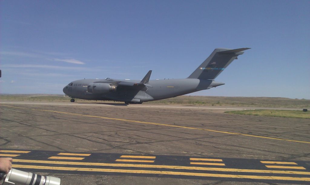 Lockheed C-130 Hercules — - Landing RWY 26L view from TWY A9