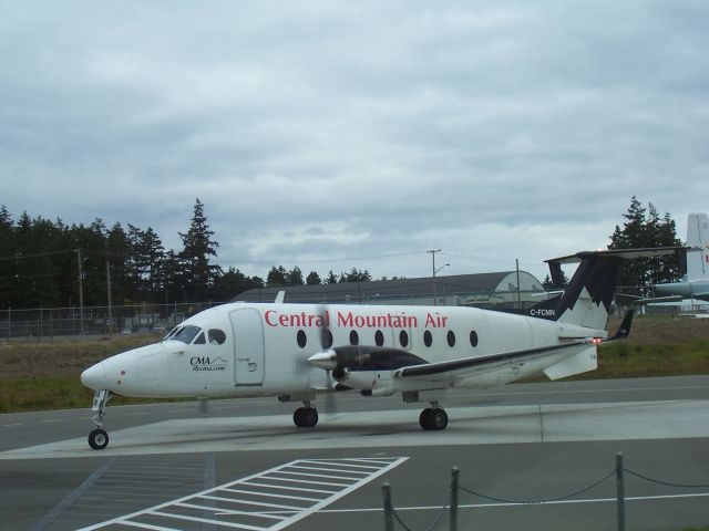 Beechcraft 1900 (C-FCMN) - Central Mountain Air  departs the gate at   Comox Valley Airport  which shares the runways with CFB Comox, BC