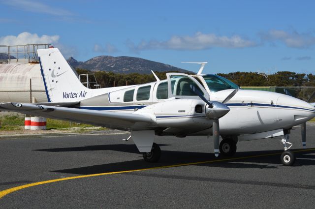 Beechcraft Baron (58) (VH-GJZ) - Vortex Air baron at Flinders Island, Sept 2016