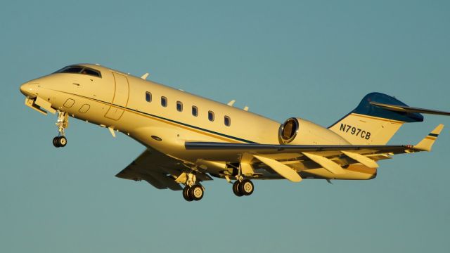 Bombardier Challenger 300 (N797CB) - 31L departure just before sunset.