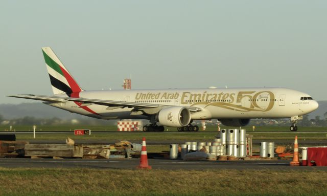 BOEING 777-300ER (A6-EGE) - A bit grainy this one, but better than nothing I suppose. A6-EGE in the UAE 50th anniversary livery, headed to Kuala Lumpur, then Dubai.