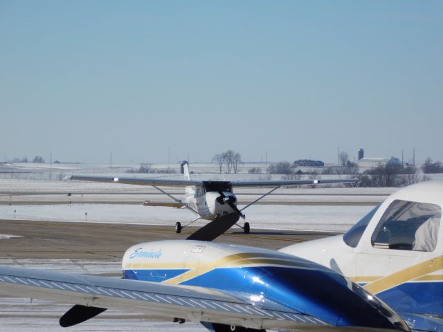 Cessna Skyhawk (N472D) - A clear day in January meant a busy day of flying for University of Dubuque Aviation students.  In this case a nearly empty ramp was a good thing!!!  N472D taxis to park after landing with a company Piper Seminole watching.